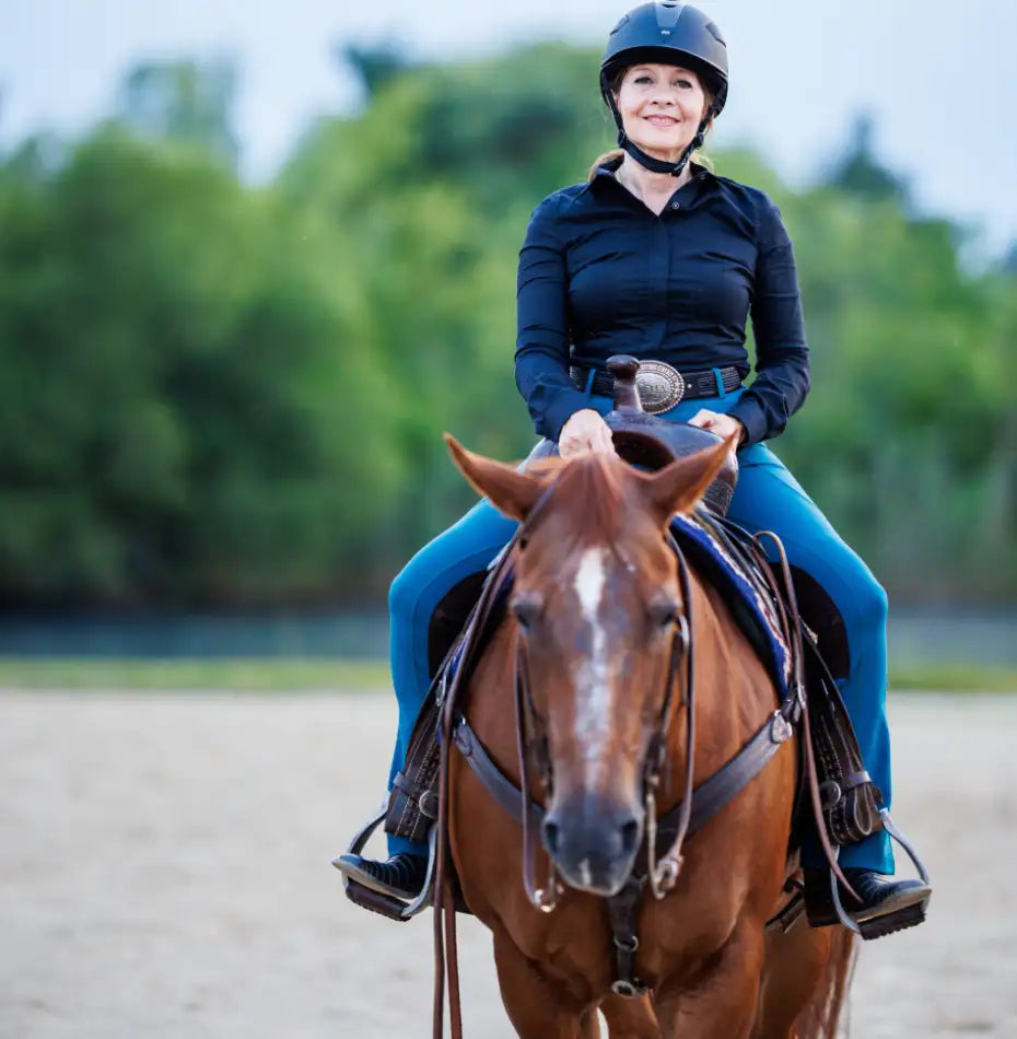 women riding horse
